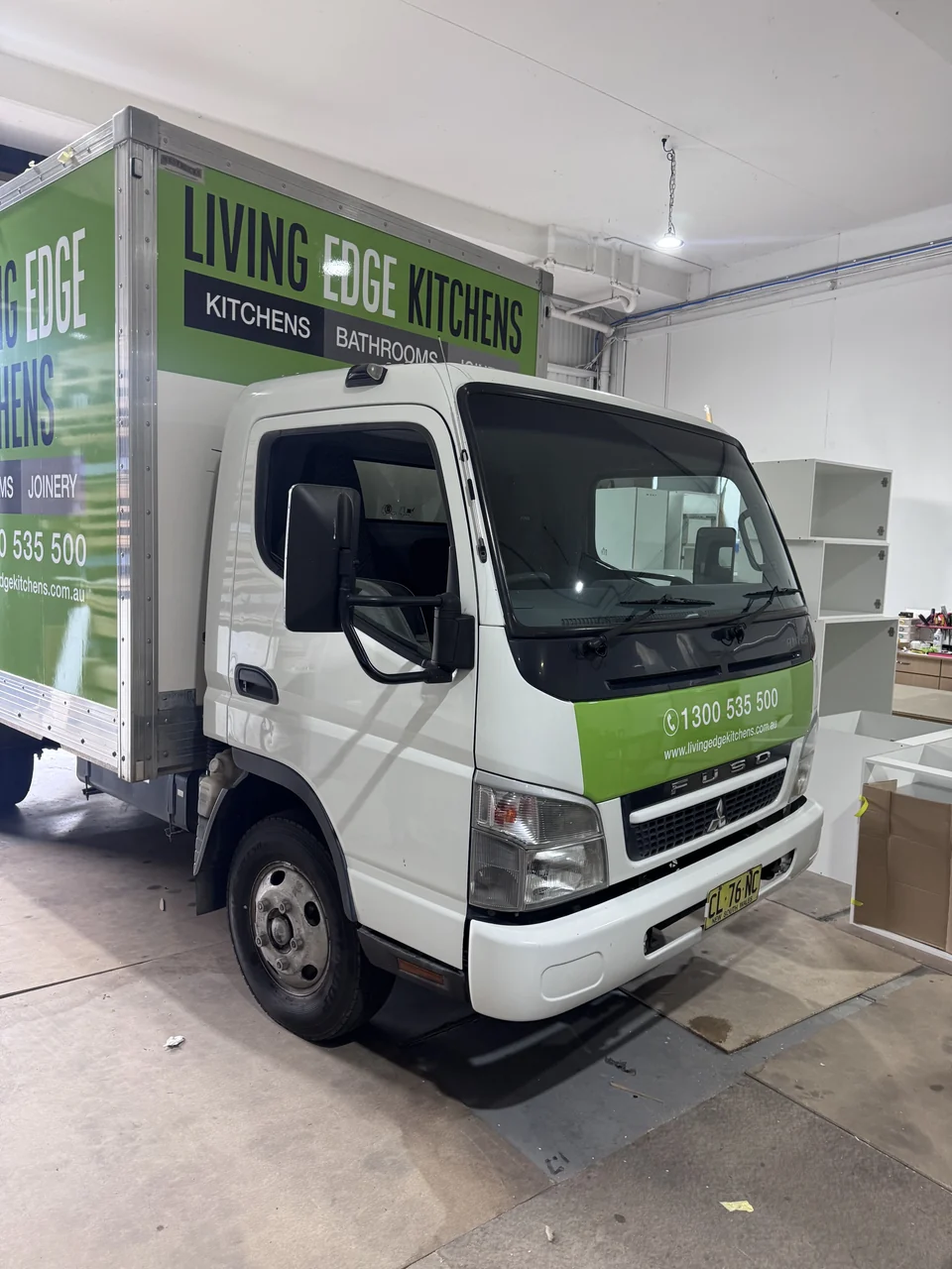 Green and white Living Edge Kitchens business graphics fitted to a box truck
