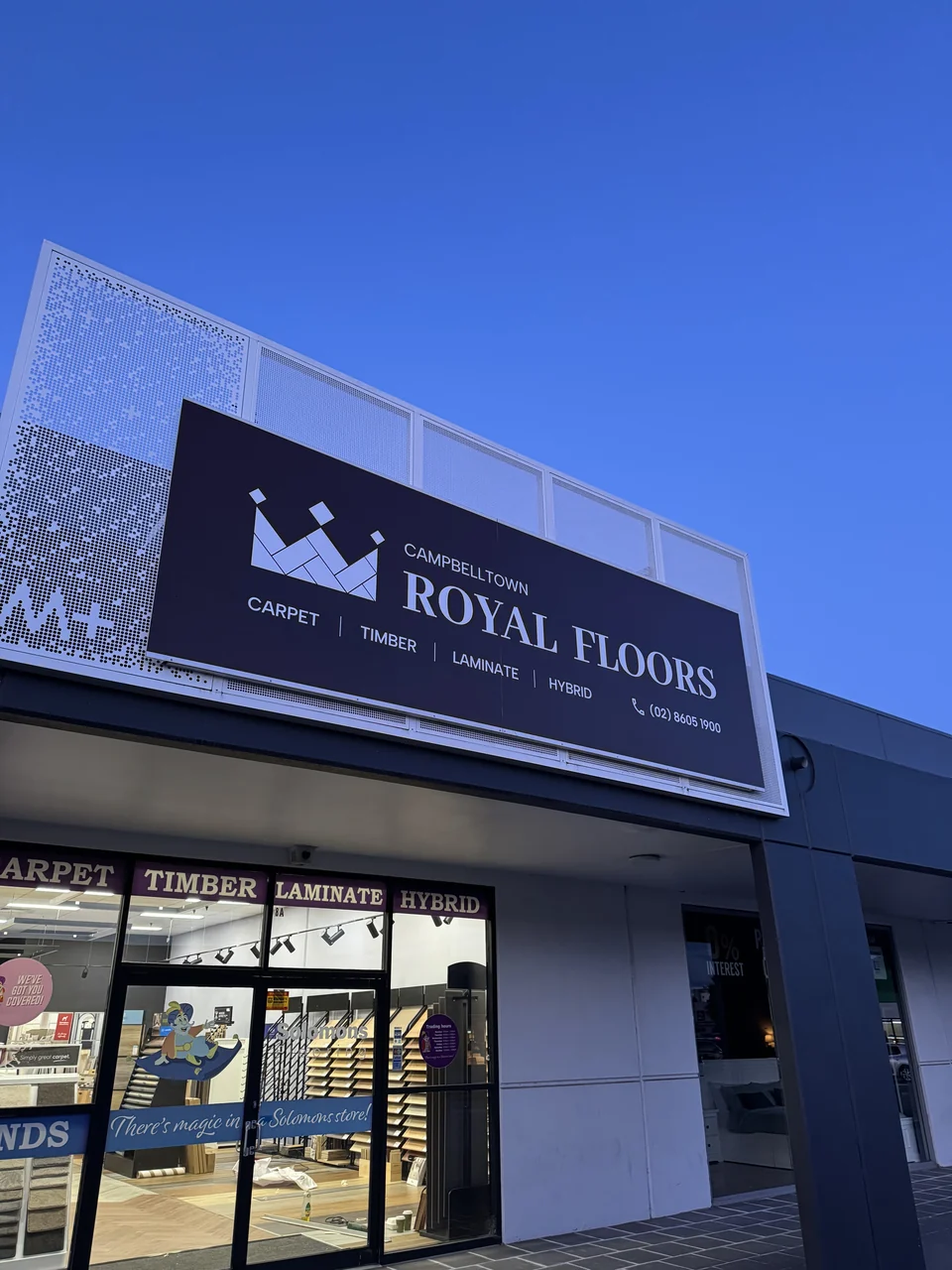 Royal Floors shopfront sign above the entrance with an unobstructed view